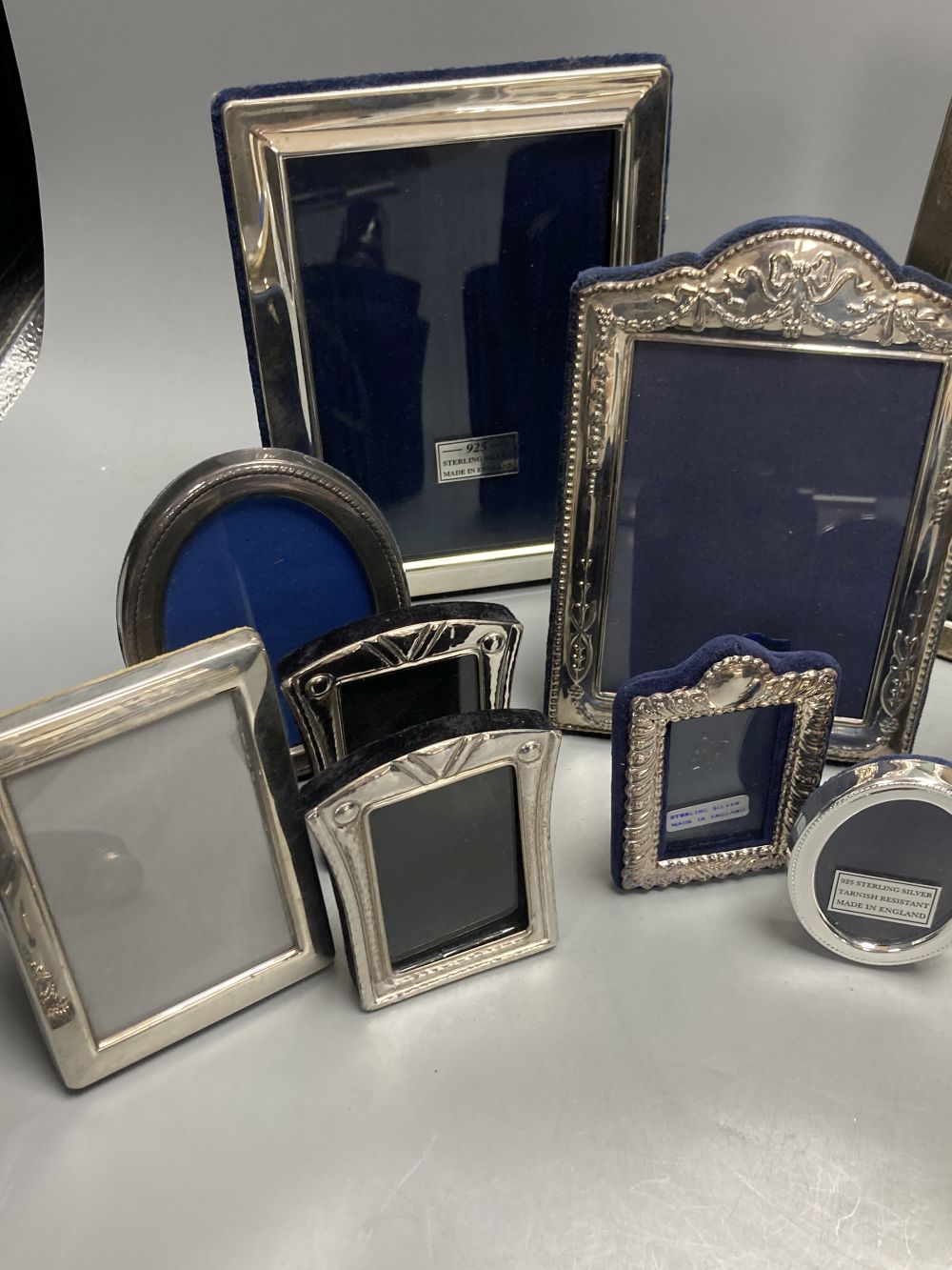 Two George V silver mounted photograph frames, largest 21cm, nine other modern silver frames and two cased silver crowns etc.